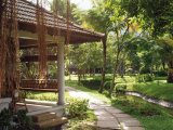 Lush tropical gardens at the Kumarakom Lake Resort, Kerala